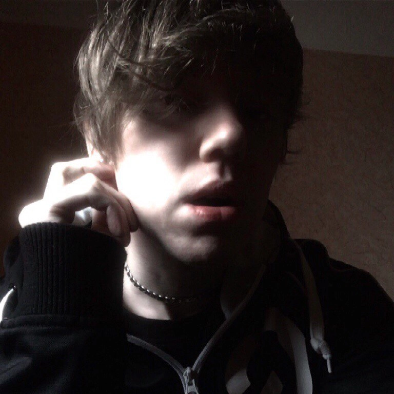 Original selfie before applying a random glitch photo effect in our dark aesthetic photo editor